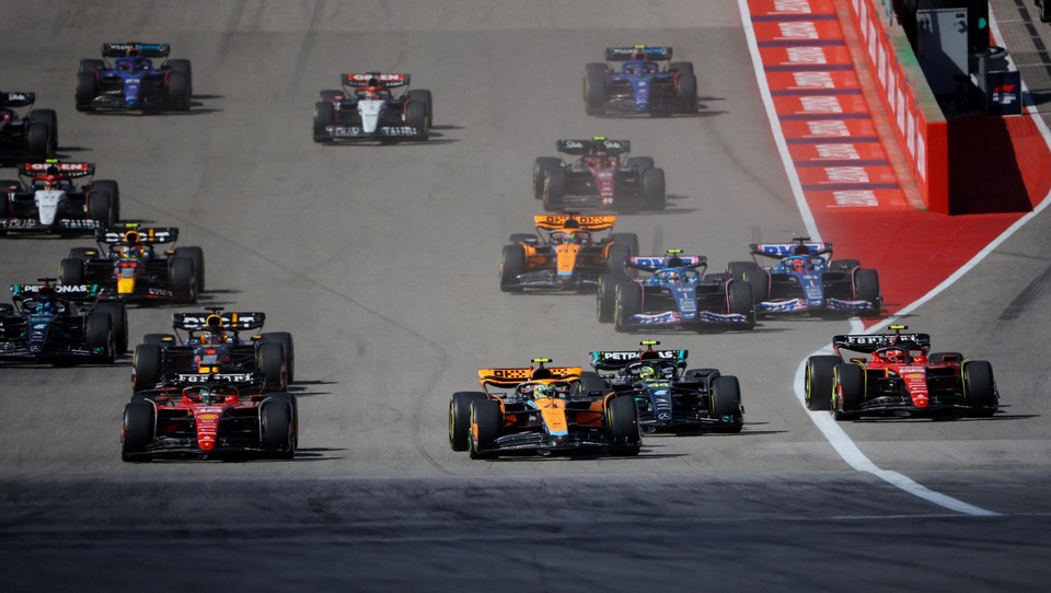 Lando Norris (middle) immediately passes Charles Leclerc at the start.