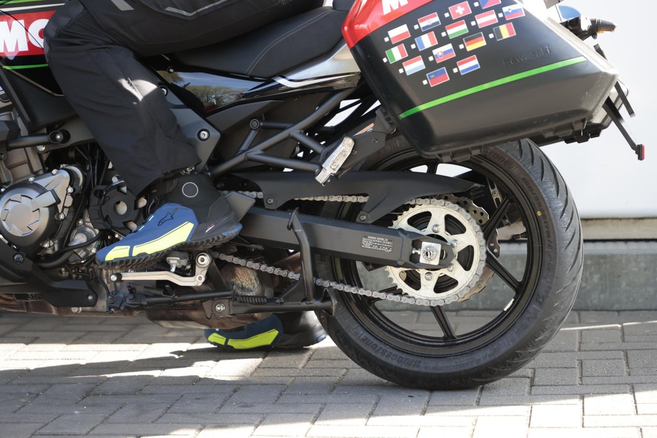 The flags of the fifteen countries he wants to cross are already on Thierry's motorcycle.