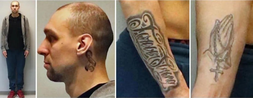 Andy de Wolf is quite large and slim built. He has two tattoos on his right forearm, and one under his left ear.