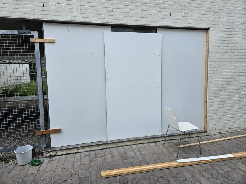 The damaged window has since been covered with a large wooden plate.