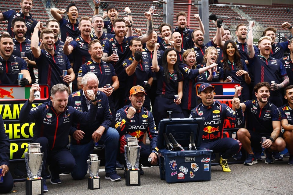 The cup is on the left in front of Christian Horner, seconds before he is knocked over.