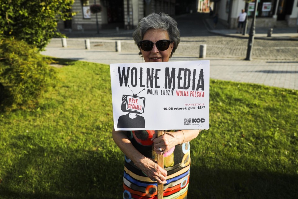 A Polish woman protests against an attack on press freedom. 