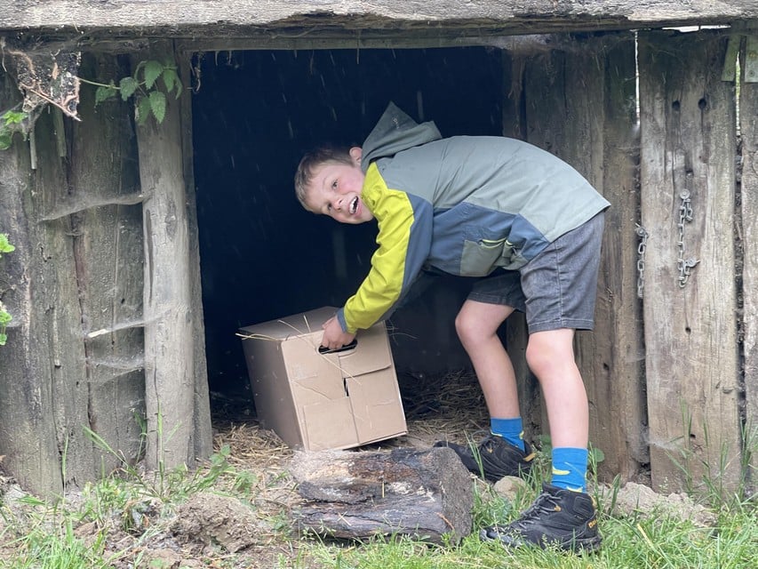 Robbe hides one of the boxes in the country retreat.