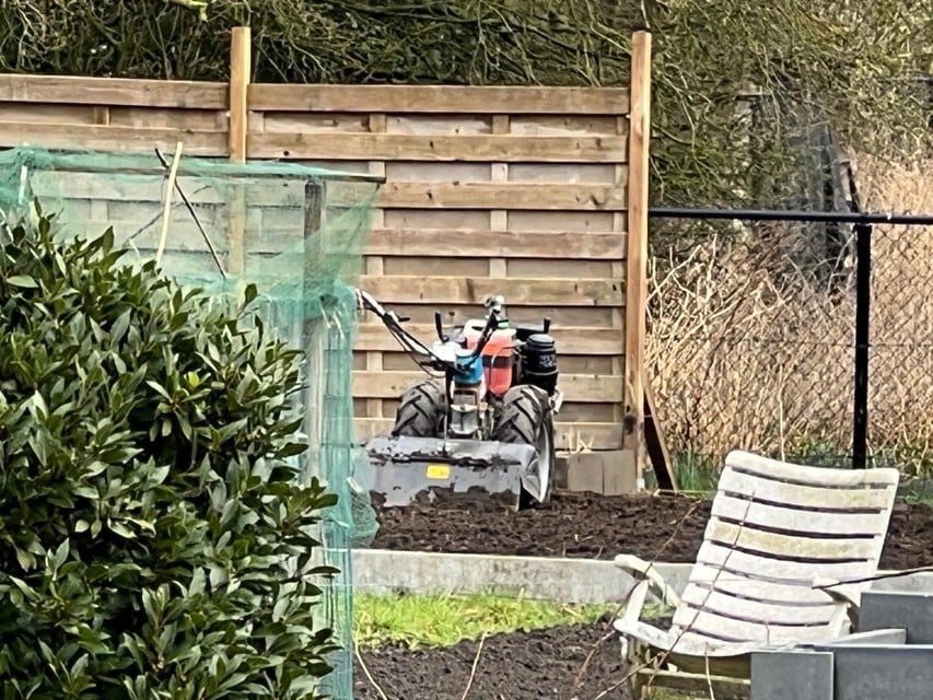 The man partly ended up under a garden mill.